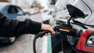 person charging their car
