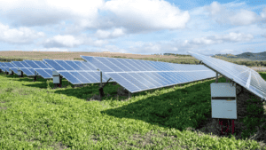 A rendering of the Oneida Energy Storage Project, showing energy storage containers and connection equipment in a field.