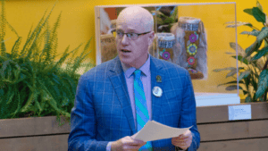 Highways and Public Works Minister Nils Clarke rises in the Yukon Legislative Assembly on April 27.